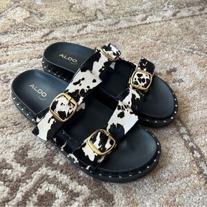 Aldo Black & White Cow Print Buckle Slides with Gold Accents